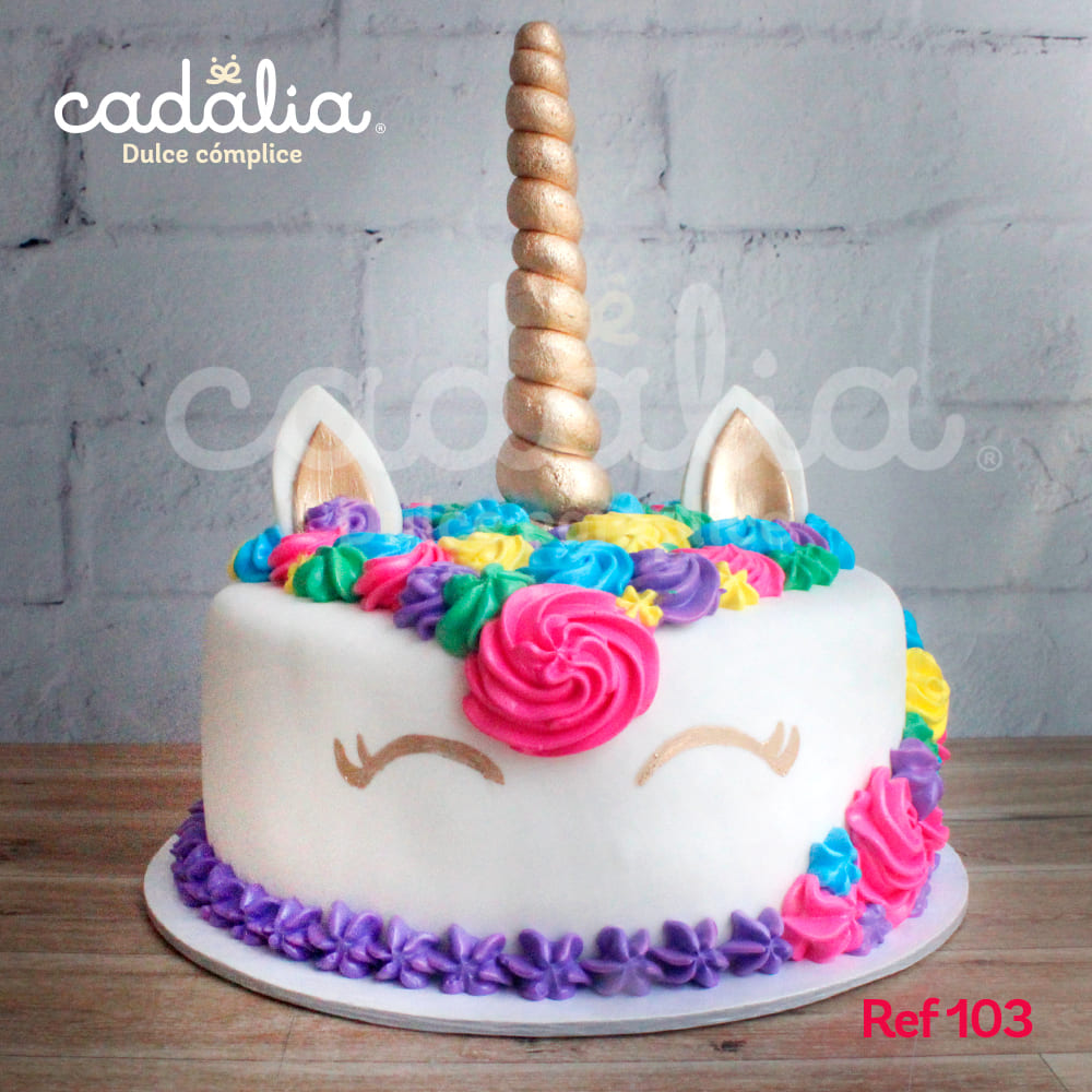 Torta personalizada Cadalia, Unicornio con flores grandes en colores fuertes, cuerno, orejas y ojos dorados